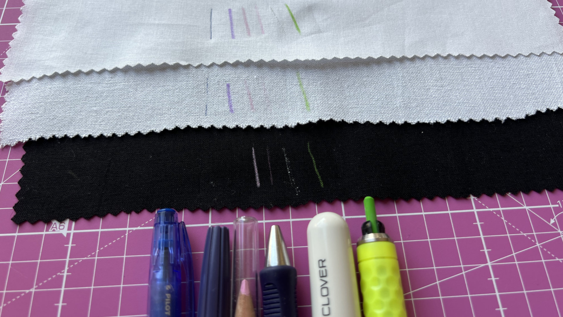 marking tools against the fabric and cutting mat